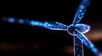 Glowing blue rope knot with sparkles on dark background creates magical atmosphere. Close up macro photography shows intricate details and light effects.