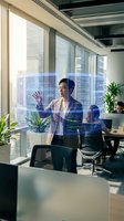 Asian businessman interacting with holographic digital interface in modern office workspace with city view and futuristic technology display.