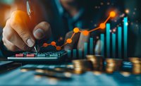 Financial analyst pointing at growing business chart with stacks of coins in foreground, demonstrating investment growth and market analysis on dark background.