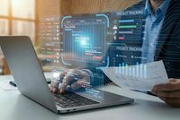 Business professional analyzing digital project management dashboard with holographic data visualization and tracking interfaces on laptop computer.
