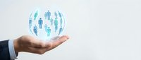 Businessman hand holding glowing globe with blue digital human figures representing global network, connectivity, teamwork, and worldwide communication for business solutions.