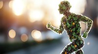 Silhouette of running person filled with green leaves and red berries on blurred bokeh background. Nature fitness concept combining healthy lifestyle and environmental themes.