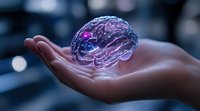 Glowing translucent brain model with purple and blue illumination floating above open palm against dark background, representing artificial intelligence and mind technology.
