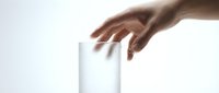 Hand reaching toward white rectangular block on clean background symbolizing choice, decision-making, and minimalist design concepts for business presentations.