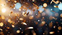 Festive golden confetti and glitter falling against dark background with blurred bokeh lights creating magical celebratory atmosphere.