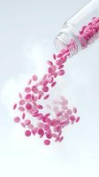 Pink pills spilling from glass bottle on white background for pharmaceutical and healthcare concepts.