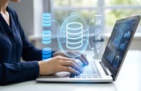 Professional woman working on laptop with holographic database icons and digital technology interface for business data management solutions.