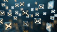 Glowing email envelope icons floating on dark blue background with bokeh effect, representing digital communication and message delivery system.
