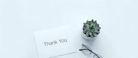 Thank you card with succulent plant and glasses on white background, flat lay minimalist style for greeting, appreciation, and gratitude concepts.
