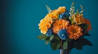 Vibrant orange dahlias and blue delphinium flowers arranged in moody composition against dark teal background, dramatic lighting creates depth and atmosphere.