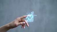 Caucasian female hand holding glowing upward trending arrow with financial chart hologram, representing business growth, investment success, and data analytics for corporate presentations.
