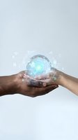 Two hands of different ethnicities holding a glowing crystal sphere with digital network icons, representing data security, technology innovation, and global connectivity for business solutions.