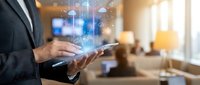Businessman using digital tablet with holographic cloud computing icons in modern office environment for technology and data management solutions.