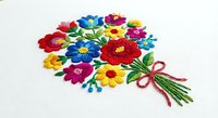 Colorful embroidered flower bouquet with vibrant blooms and green ribbon on white fabric. Traditional folk art needlework craft design for textile decoration.
