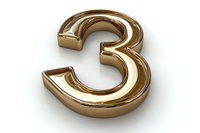 Golden metallic number three on white isolated background, dimensional shiny symbol for anniversary, ranking or mathematical design.
