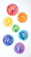 Watercolor spiral circles in vibrant rainbow colors including pink, orange, yellow, green, blue, and purple on white background. Isolated design elements suitable for graphic design, web projects, and creative compositions.