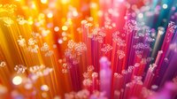 Vibrant fiber optic cables with glowing ends create abstract light pattern in orange and purple gradient background with bokeh effect and luminous dots.