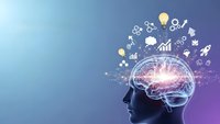 Human head silhouette with glowing brain and business icons on gradient background representing artificial intelligence and innovation concepts.