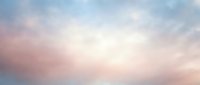 Soft pastel sky with pink, blue, and white clouds at sunrise or sunset, suitable for backgrounds, web design, and atmospheric overlays.