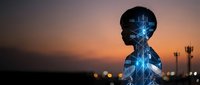 Digital silhouette of person with glowing blue neural network connections inside head against sunset sky. Artificial intelligence and technology concept.