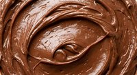 Rich creamy chocolate spread with smooth swirled texture for baking, desserts, and culinary applications.