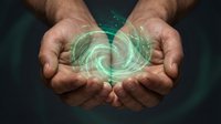 Male hands cupping glowing green digital energy sphere with swirling light patterns and technological elements for futuristic concepts and innovation themes.