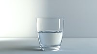 Clear glass half filled with water on light gray background, minimalist composition with soft shadows and reflections showing purity and freshness.