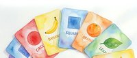 Watercolor educational flashcards showing basic shapes and objects including circle, square, banana, orange and leaf for early childhood learning.