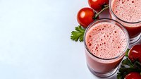 Fresh tomato juice in glasses with cherry tomatoes and parsley on white background. Healthy vegetable drink for breakfast and detox diet.