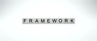 Wooden letter blocks spelling FRAMEWORK on white background for business strategy and organizational structure concepts.