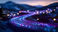 Winding mountain road illuminated by blue and purple lights creating magical bokeh effect against twilight sky, long exposure photography captures glowing path.