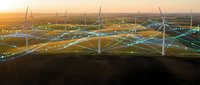 Wind farm at sunset with glowing digital network overlay, symbolizing smart energy grid technology and renewable power innovation.