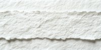 Torn white paper edge creating natural rough textured border on white background, isolated design element for creative layouts and digital compositions.
