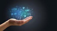 Hand holding glowing digital network with connected icons, representing data security, cloud computing, and technology innovation for business solutions.