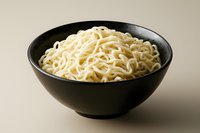 Cooked instant ramen noodles served in black ceramic bowl on neutral background ready for food photography and culinary design projects.