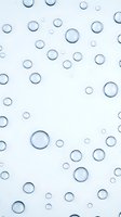Abstract blue water bubbles floating on light background creating clean minimalist pattern for modern design projects and digital artwork applications.