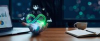Businessman holding glowing green infinity symbol with digital icons representing sustainable business growth and circular economy concepts in modern office.