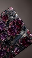 Raw mineral specimen with deep purple and pink crystals embedded in dark matrix rock formation displaying natural geological structure and texture.