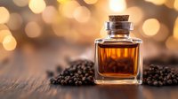 Small glass bottle with amber liquid surrounded by black peppercorns on wooden surface against warm bokeh background, aromatic spice still life composition.