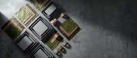 Professional makeup palette with green eyeshadows and brushes arranged on dark concrete surface for beauty and cosmetics applications.