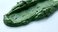 Fresh green cucumber with water droplets isolated on white background, suitable for food, nutrition, and culinary design projects.