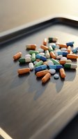Colorful pharmaceutical capsules and pills scattered on wooden surface for healthcare and medical treatment concepts.