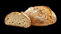 Freshly baked rustic sourdough bread loaf with a sliced piece showing texture, isolated on transparent background, ready for stickers, menus, and print on demand.