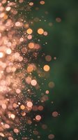 Abstract bokeh lights with warm golden and pink circles on dark green gradient background for festive holiday designs and celebrations.