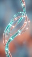 Glowing fiber optic cables with turquoise and coral light streams flowing in elegant curves against soft gradient background for technology designs.