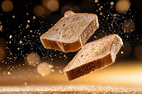 Floating slices of fresh bread with flour dust particles against dark background with golden bokeh lights, dramatic food photography in motion.