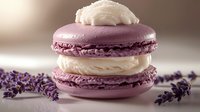 Lavender-flavored French macaron with creamy vanilla filling, decorated with lavender sprigs on a neutral background for gourmet dessert photography.