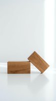Two wooden blocks with natural grain texture positioned on white surface against neutral background for product display and branding mockups.