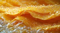 Fresh orange citrus slice in macro view showing juicy pulp texture with water drops and bubbles, natural fruit close-up photography for healthy food concept.