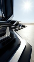 Modern futuristic architecture with sleek black and white geometric forms in desert landscape under bright sunlight, suitable for corporate and tech design projects.